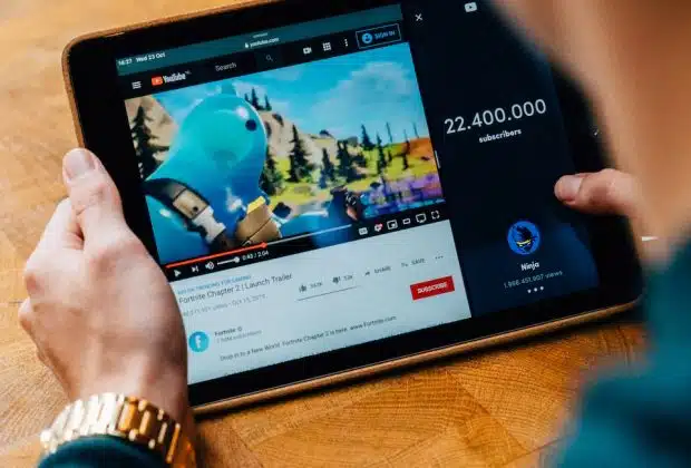 selective focus photography of person using tablet computer